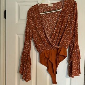 Burnt orange fall floral long sleeve bodysuit